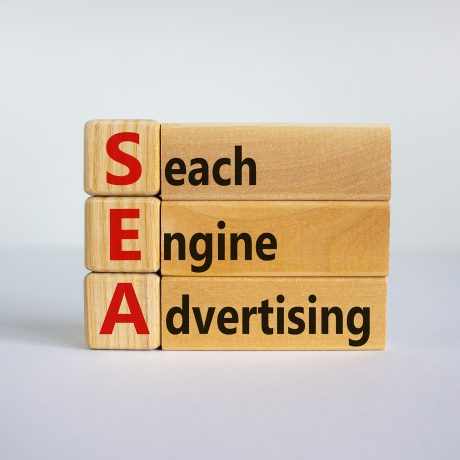 SEA - search engine advertising symbol. Wooden cubes with words 'SEA - search engine advertising'. Beautiful white background, copy space. Business and SEA - search engine advertising concept.